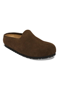 A single slip-on clog shoe in brown suede with a dark brown sole, shown from a three-quarters angle on a white background.