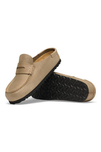 A pair of beige suede penny loafers with black treaded soles, shown on a clean white background.