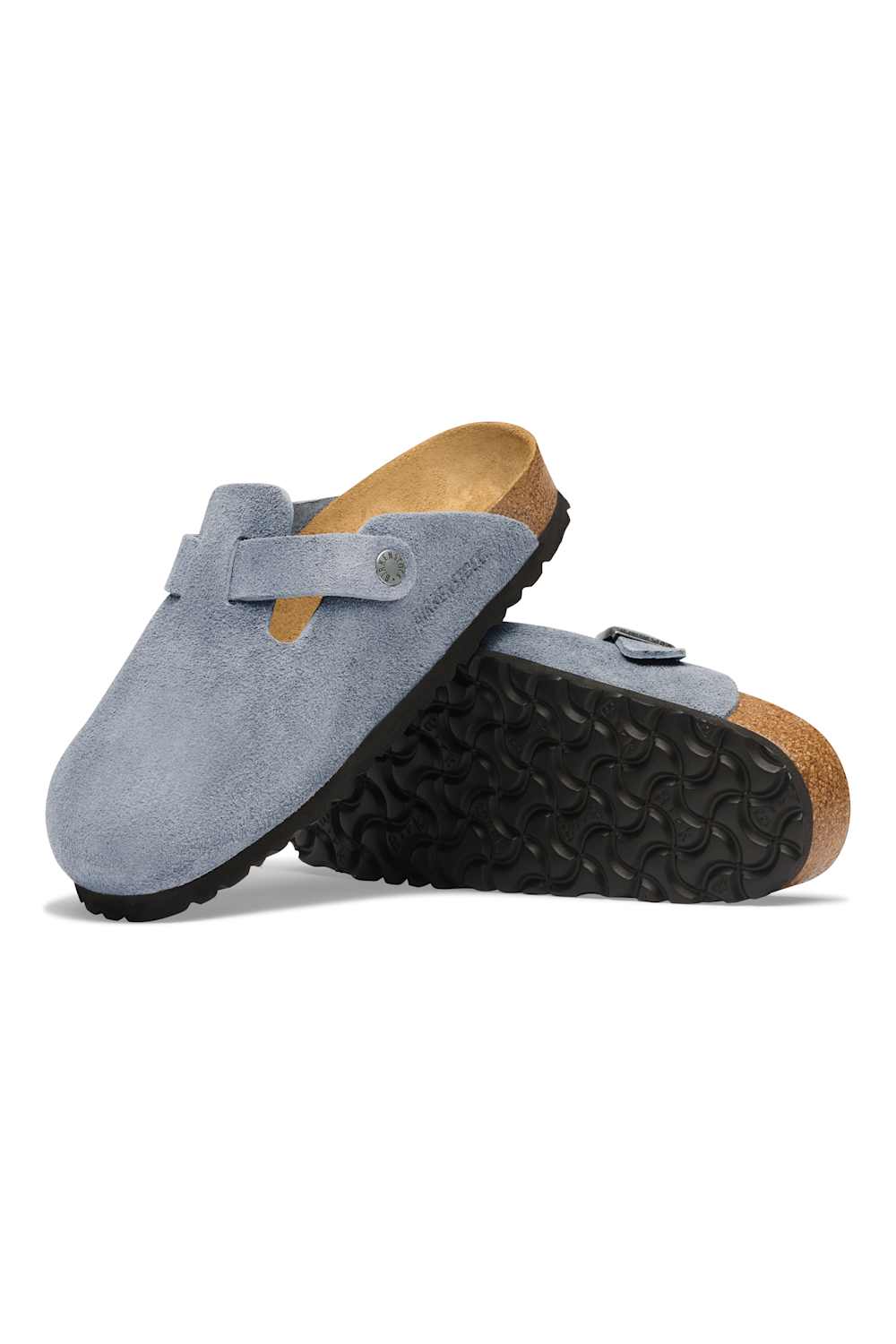 A pair of light blue suede clogs with tan footbeds and black textured soles, displayed on a clean white background.