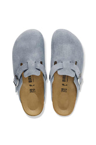 A pair of Birkenstock Birkas slip-on clogs in light blue suede, shown from a top-down view on a white background.