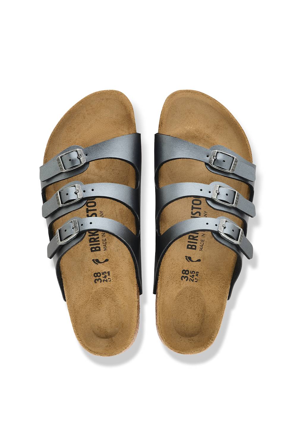 A pair of Birkenstock sandals with metallic silver straps and adjustable buckles, set against a clean white background.