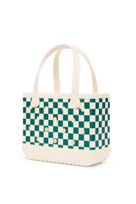 A woven tote bag featuring a green and cream checkerboard pattern with solid cream handles and base, shown on a clean white background.