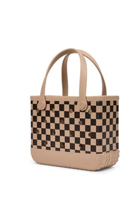 A structured tote bag featuring a black and beige checkerboard pattern on the main body, with solid beige handles and base, photographed on a clean white background.