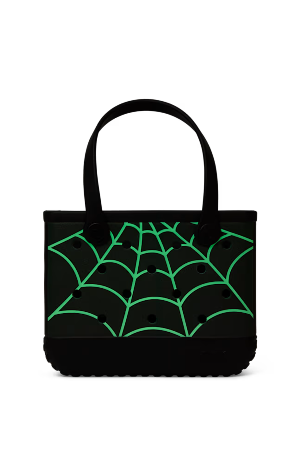 A black tote bag with a bright green glow in the dark spiderweb pattern printed across the front, featuring two black shoulder straps, set against a plain white background.