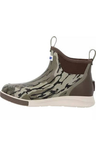 A single rubber ankle boot with a green and black bark-like camouflage pattern, brown elastic side panels, a brown pull tab, and a thick off-white sole.