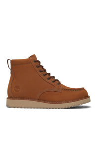 A single Timberland ankle boot in tan brown suede, featuring dark brown laces, a pull tab, and a light tan rubber sole, shown from a side profile on a white background.