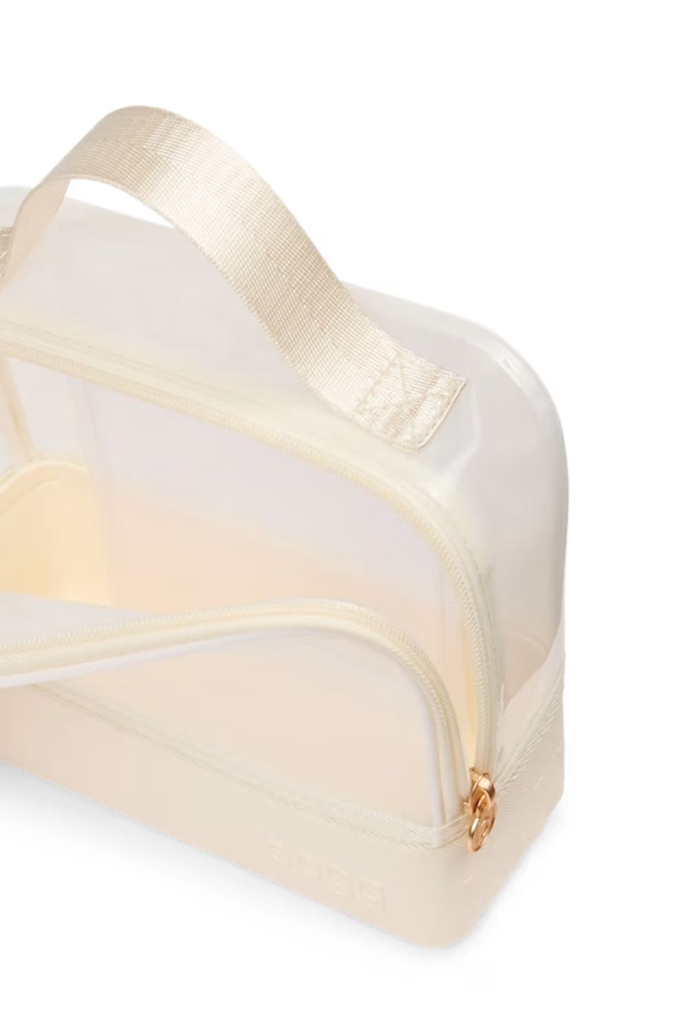 A translucent cream makeup bag with a matching fabric handle and a small gold zipper pull, shown on a plain white background.