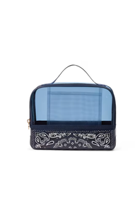 A rectangular travel packing cube with a translucent light blue top half and a navy blue bottom half featuring a white paisley bandana print, complete with a top handle and zipper closure.