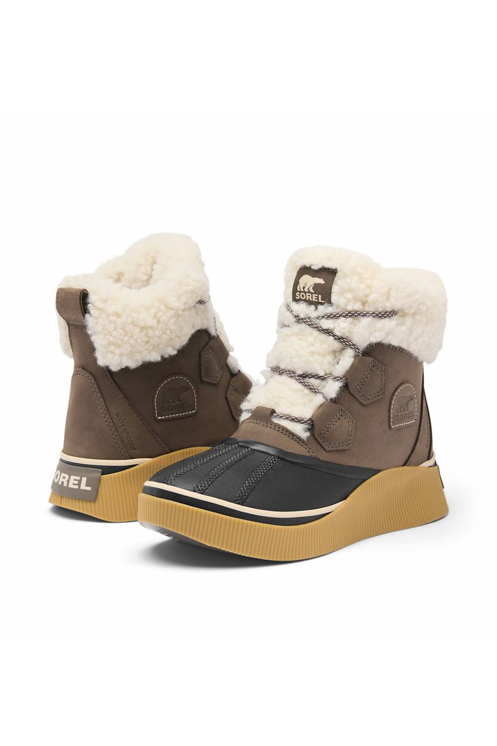 A pair of Merrel mid-calf winter boots in brown and black with thick tan soles and cream shearling lining, shown against a plain white background.