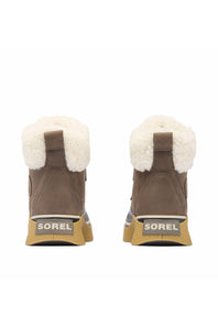 A pair of Sorel boots shown from the back, featuring a brown suede upper, white shearling lining, and a tan and gray sole with the SOREL brand name clearly visible.