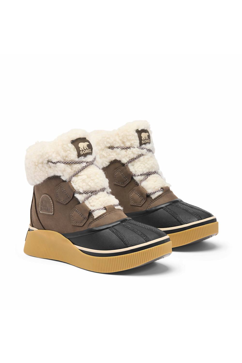 A pair of brown and black winter boots with thick cream shearling trim and tan soles, shown on a plain white background.