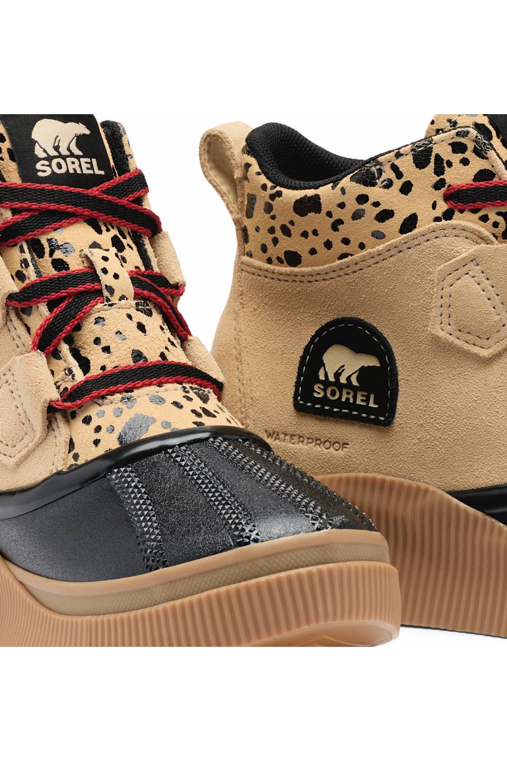 close-up of the shoe’s black toe cap, red patterned laces, and printed upper.