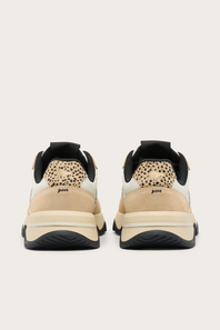 A pair of Juven sneakers shown from the back, featuring beige suede panels, a beige and black leopard print heel tab, black collar lining, and chunky black and beige platform soles.