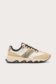 A low-top sneaker in beige and off-white with a leopard-print side panel and black laces, shown in a side profile on a light beige background.