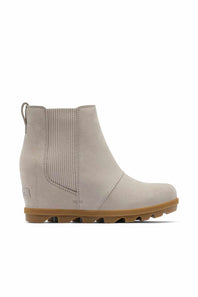 A light beige suede Chelsea-style ankle boot with a wedge heel and a brown lug sole, shown from a side profile on a white background.