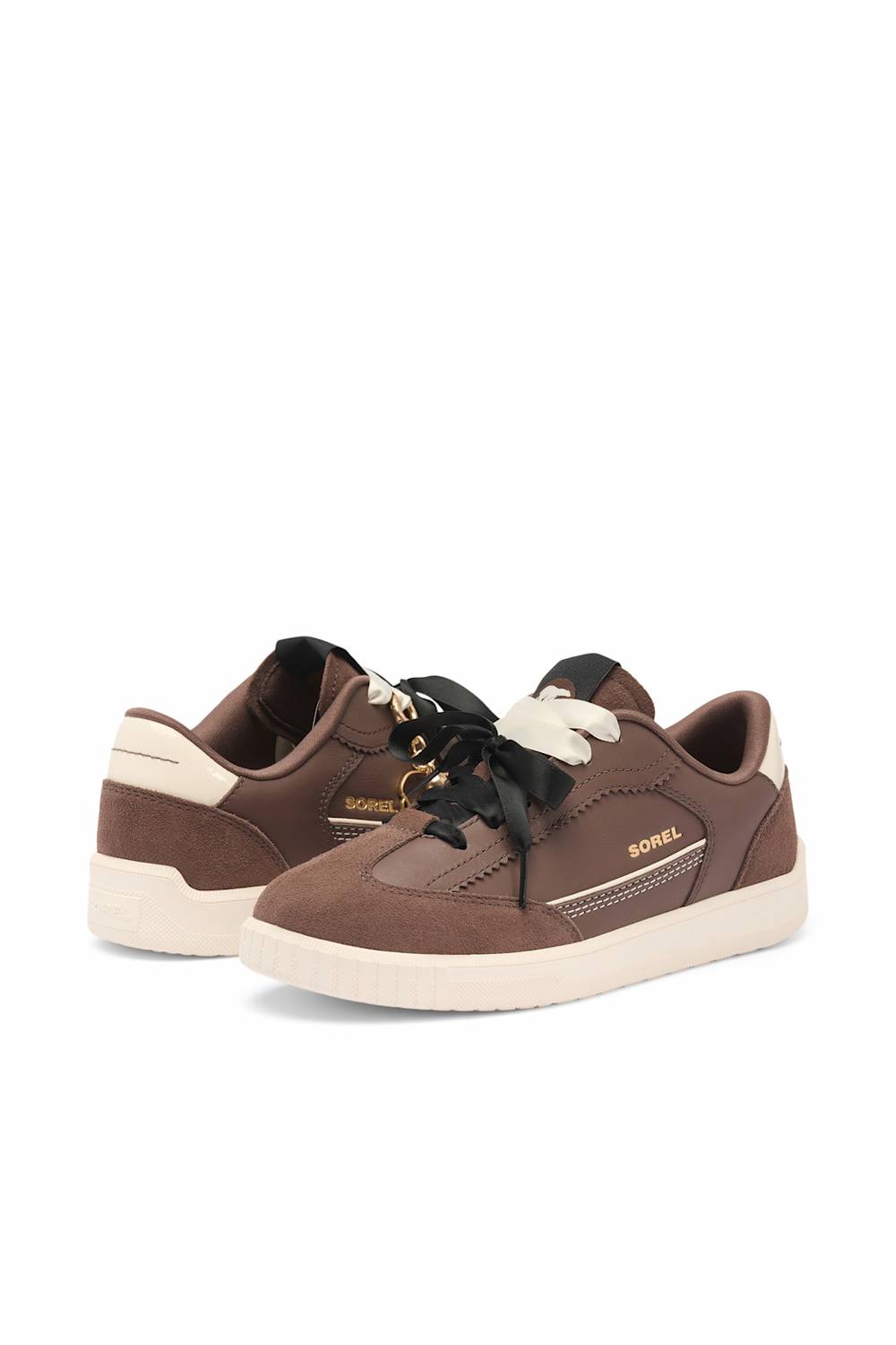 A pair of brown suede sneakers with black laces, cream-colored midsoles and heel accents, and gold branding on a white background.