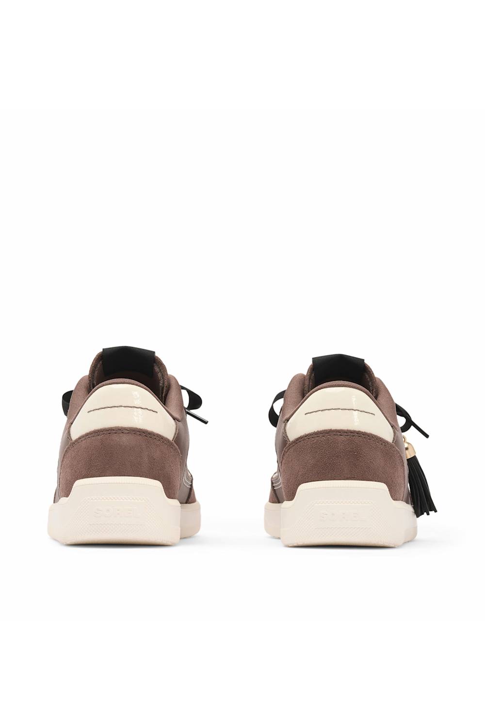 A pair of low-top sneakers shown from the back, featuring a brown suede upper with cream-colored heel panels and thick cream midsoles, set against a plain white background.