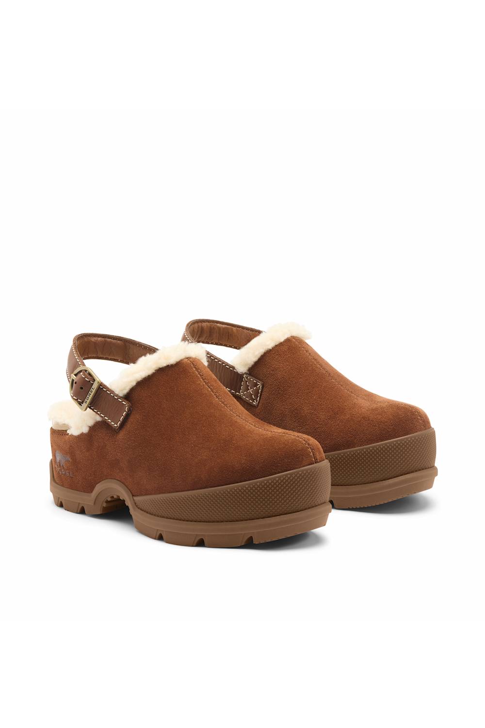 A pair of brown suede clogs with white shearling lining and a brown platform sole, shown against a plain white background.
