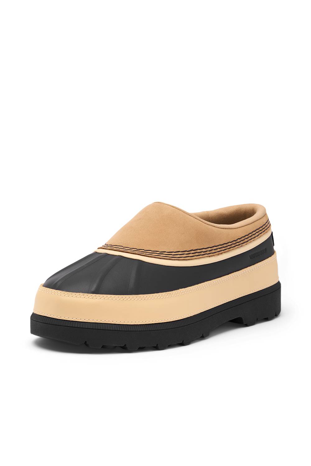 A slip-on clog-style shoe with a tan suede upper, a black rubber toe cap, a beige midsole stripe, and a black outsole, shown on a plain white background.