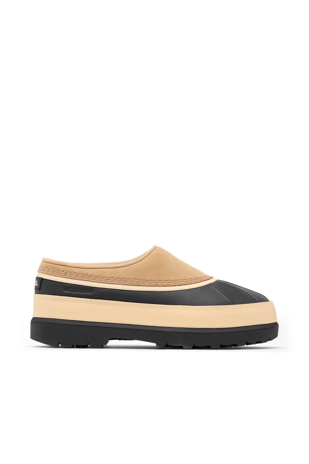 A single slip-on clog-style shoe shown in side profile on a plain white background. The upper is tan/beige with a black toe cap and black heel detail, and it has a thick beige midsole with a black outsole.