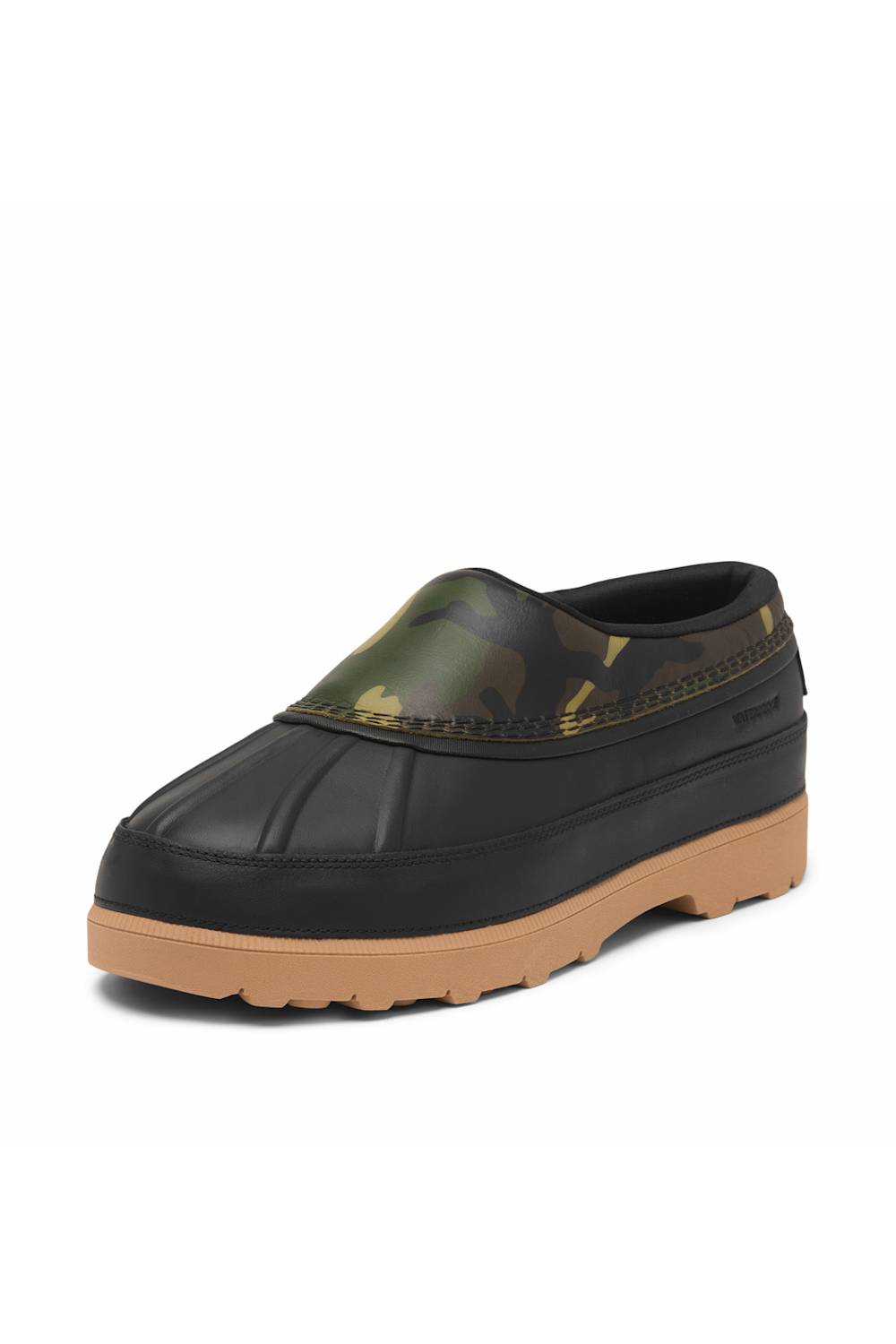 A single slip-on clog-style shoe with a black rubber toe cap and sole, a tan gum sole, and a green camouflage patterned upper, shown on a plain white background.