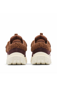 A pair of brown and burgundy fuzzy knit sneakers shown from the back, featuring thick cream-colored chunky soles, set against a plain white background.