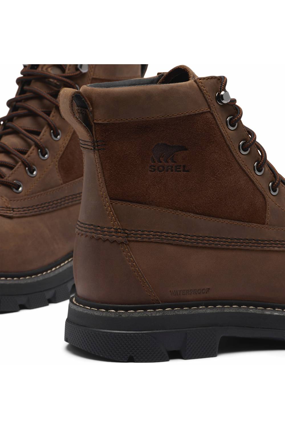 A close-up of a brown suede and leather lace-up boot with the Sorel brand logo embossed on the side, set against a plain white background.
