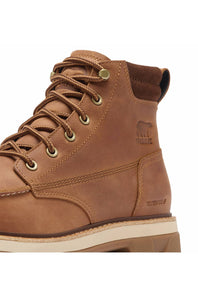 A close-up of a brown suede and leather work boot with tan laces, brass eyelets, and a beige and brown sole, featuring the Sorensen bear logo on the side.