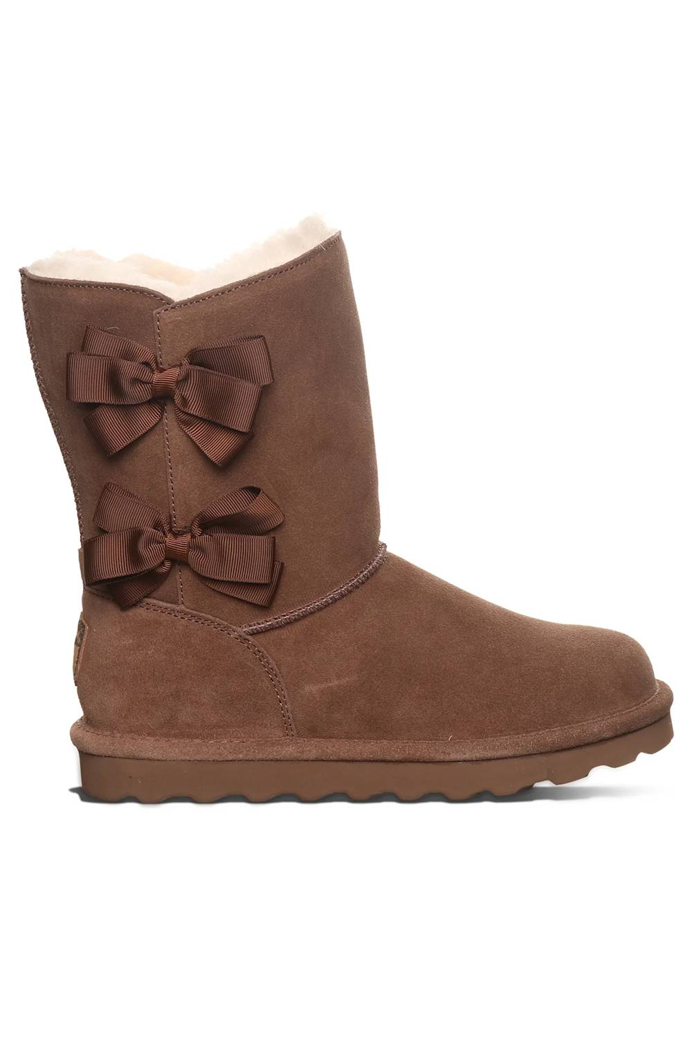 A brown suede ankle boot with two large matching brown bows on the side and a light beige shearling lining visible at the top, shown against a plain white background.