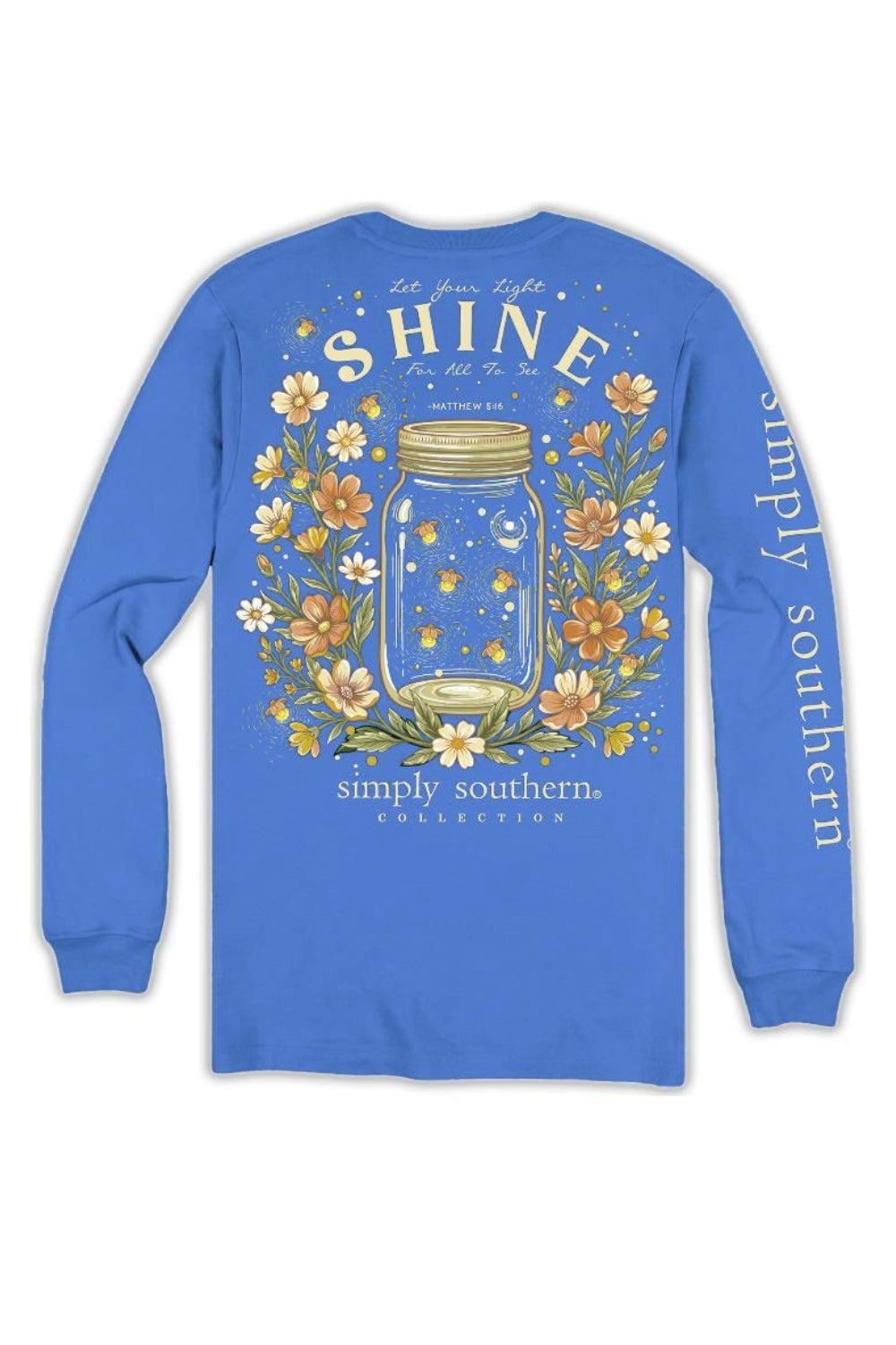 A royal blue long-sleeve t-shirt with a large graphic on the back featuring a mason jar, glowing fireflies, and white flowers, with 'SHINE' printed in large letters and 'simply southern COLLECTION' below. The left sleeve features 'simply southern' printed vertically in white.