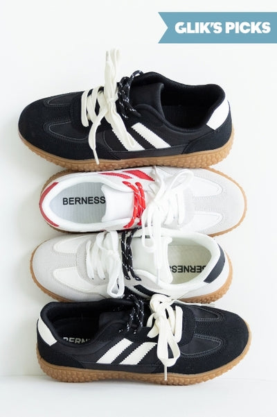 4 styles of sneakers stacked on top of each other (from bottom to top, black/white sneaker, white/black sneaker, white/red sneaker, and the same black/white sneaker on bottom) against a plain wall and a blue flag badge in the upper right corner that read GLIK'S PICKS
