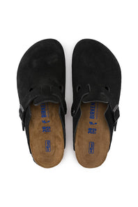 A pair of black suede Birkenstock clogs shown from a top-down view on a white background.