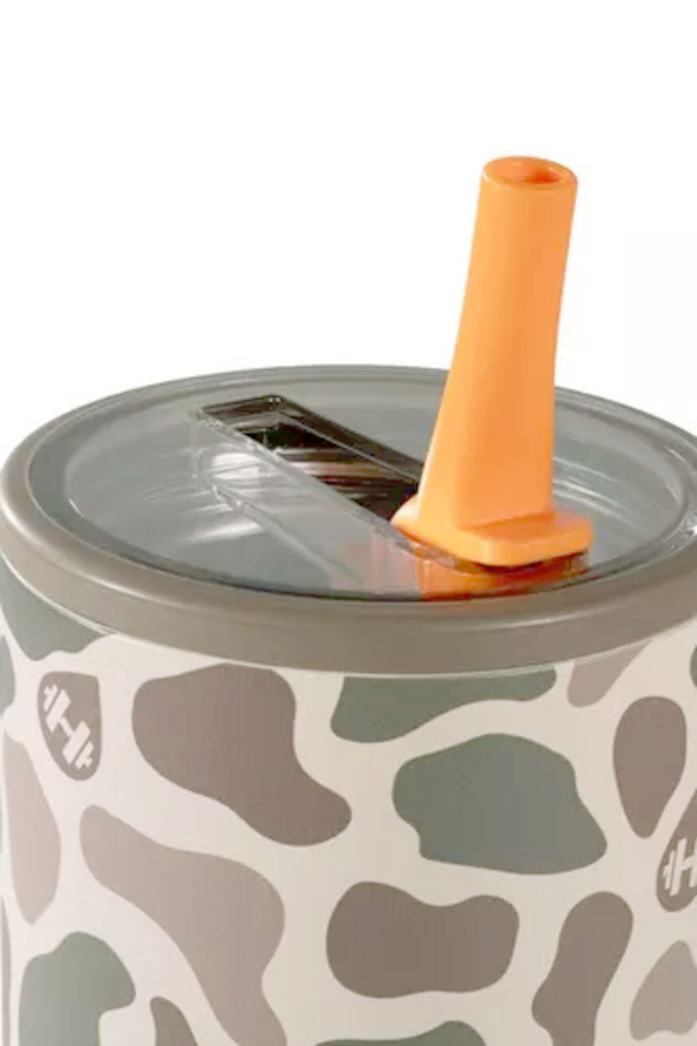 A close-up of a tumbler with a gray and brown cow print pattern, a clear lid, and an orange flip-straw lid component, shown against a white background.
