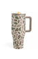 A travel tumbler with a handle, featuring an organic camouflage pattern in shades of green, brown, and beige on a white background. It has a matching beige handle, a beige lid, and a small orange tab on top.