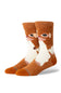 A pair of crew socks featuring a stylized cartoon face in brown and white, with orange toes and heels, shown on a plain white background.