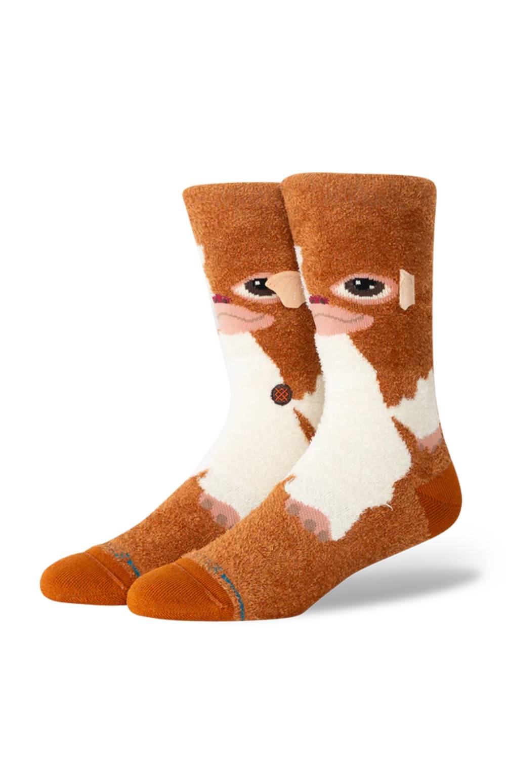 A pair of crew socks featuring a stylized cartoon face in brown and white, with orange toes and heels, shown on a plain white background.