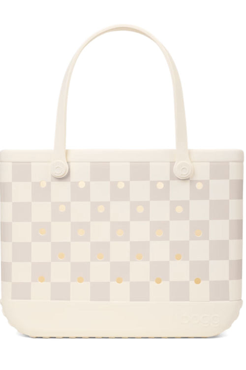 A light beige and off-white checkered tote bag with small gold polka dots and cream-colored shoulder straps, shown against a plain white background.