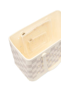 A cream-colored plastic storage basket with a light gray and white checkerboard pattern on the exterior, featuring a clear plastic insert tray inside and a side handle, shown on a white background.