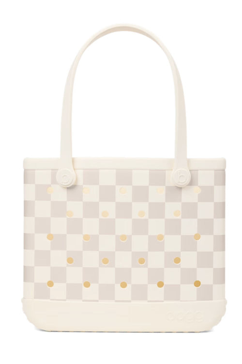 A structured tote bag featuring a cream and light beige checkerboard pattern with small gold polka dots, set against a plain white background.