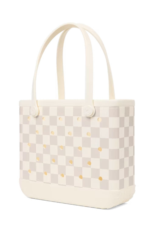A cream and beige checkerboard tote bag with small gold polka dots and dual top handles, shown on a plain white background.