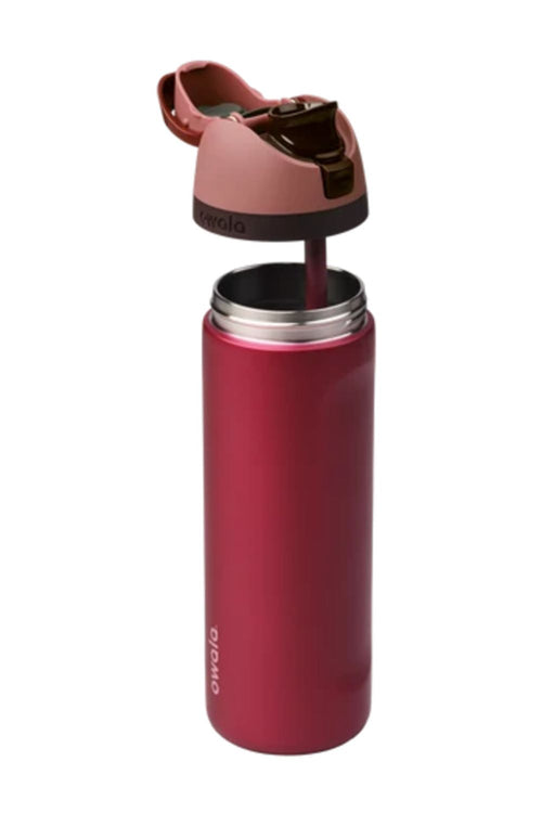 Owala FreeSip 24 oz stainless steel water bottle in Poinsettia (red) shown with the lid open and detached/raised slightly against a white background.