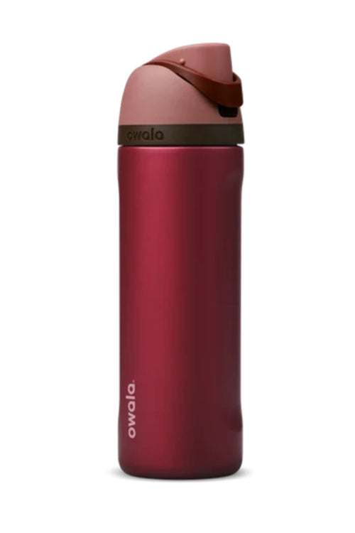 Owala FreeSip 24 oz stainless steel water bottle in Poinsettia (red) standing upright against a white background.