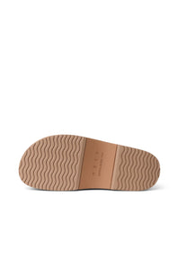 The outsole of a tan shoe, showing a wavy tread pattern and the embossed brand name 'MERCER' on a clean white background.