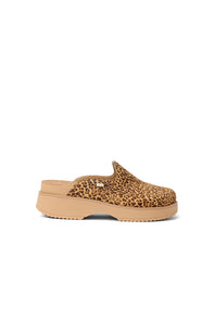 A single slip-on clog shoe with a tan and brown leopard print upper and a tan sole, shown from a side profile on a white background.