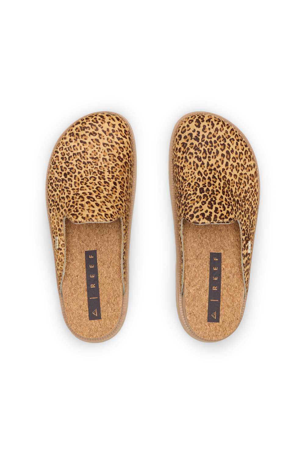 A pair of slip-on mule slippers with a tan and brown leopard print upper and a natural cork footbed, shown from a top-down view on a white background.
