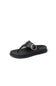 Black sandal with a gold buckle on a white background