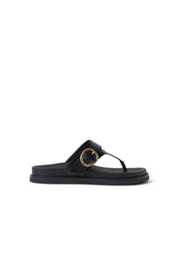 Black sandal with a gold buckle on a white background