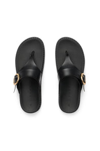 Pair of black sandals with gold accents on a white background
