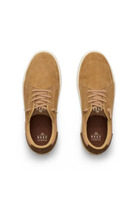 A pair of tan suede low-top sneakers shown from a top-down view on a white background. The shoes feature matching tan laces, a brown textured heel tab, and a white midsole.