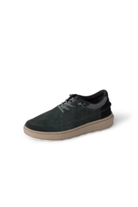 A single low-top sneaker in dark charcoal gray suede with a tan rubber sole, shown from a three-quarters angle on a white background.